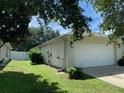 Side view of house with garage and fenced yard at 4311 Sw 53Rd Ter, Ocala, FL 34474