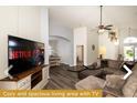 Cozy living area with large TV and comfortable seating at 443 Corvina Dr, Davenport, FL 33897