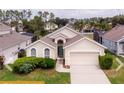Aerial view of charming house with green lawn at 443 Corvina Dr, Davenport, FL 33897