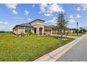 One-story home with brick driveway and landscaped yard at 647 San Augusto Dr, Poinciana, FL 34759