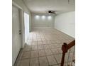 Large living room with tile floor and access to exterior at 4009 Shannon Brown Dr, Orlando, FL 32808