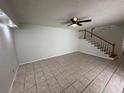 Living room with tile flooring and staircase at 4009 Shannon Brown Dr, Orlando, FL 32808