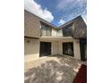 Back exterior view of townhouse with patio and balcony at 4009 Shannon Brown Dr, Orlando, FL 32808