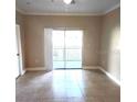 Bright living room with tile flooring and sliding glass doors at 3701 Castle Pines Ln # 3914, Orlando, FL 32839