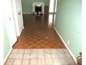 Entryway with parquet flooring and view into living room at 348 Jacksonville Ct, Kissimmee, FL 34759