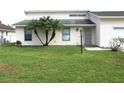 House exterior with a one-car garage and palm trees at 348 Jacksonville Ct, Kissimmee, FL 34759