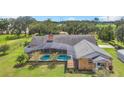 Brick home with a large pool and screened enclosure at 4147 Boggy Creek Rd, Kissimmee, FL 34744