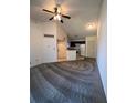 Spacious living room with carpet and a ceiling fan at 1916 Lake Atriums Cir # 46, Orlando, FL 32839
