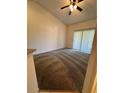 Bright living room with carpet and sliding doors at 1916 Lake Atriums Cir # 46, Orlando, FL 32839