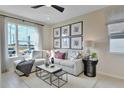 Bright living room featuring a sectional sofa and large windows at 1401 Levy Bend Dr, Kissimmee, FL 34744