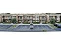 Modern townhome community with parking and landscaping at 3213 Brasilia Ave, Kissimmee, FL 34747