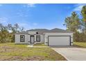 Single-story home with attached garage at 2396 Sw 147Th Lane Rd, Ocala, FL 34473