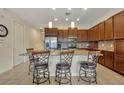 Modern kitchen with stainless steel appliances and granite countertops at 274 Captiva Dr, Davenport, FL 33896