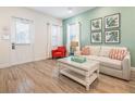 Light and airy living room with a sofa and coffee table near the entrance at 3037 Sea Plane Ln, Kissimmee, FL 34747
