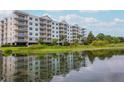 Lakeside community featuring a multi-story building with balconies at 4177 N Orange Blossom Trl # 210, Orlando, FL 32804