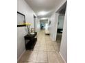 Bright hallway with tile flooring and access to other rooms at 4738 Blue Diamond St, Kissimmee, FL 34746