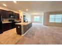 Modern kitchen with an island and stainless steel appliances at 3073 Royal Tern Dr, Winter Haven, FL 33881