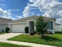 Exterior view of a single story home with a two-car garage at 3073 Royal Tern Dr, Winter Haven, FL 33881