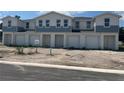 Newly constructed townhome-style property with attached garages at 1774 Tila St, Kissimmee, FL 34746