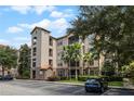 Three-story condo building with ample parking and landscaping at 1301 Tuscan Ter # 9403, Davenport, FL 33896
