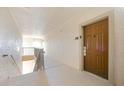 Interior hallway with access to condo unit and stairs at 1301 Tuscan Ter # 9403, Davenport, FL 33896