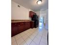 Spacious kitchen with dark wood cabinets and stainless steel appliances at 5150 Picadilly Circus Ct # 7, Orlando, FL 32839