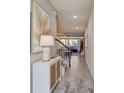Bright and airy entryway with a stylish console table and view to the living room at 1842 Tropical Palms Cir, Kissimmee, FL 34747