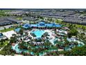 Aerial view of community pool, water features, and residential buildings at 2290 Lelani Cir, Davenport, FL 33897