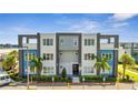Modern building exterior with balconies and parking at 7770 Sandy Ridge Dr # 201, Reunion, FL 34747