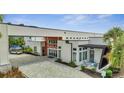 Modern building exterior with courtyard and seating at 7770 Sandy Ridge Dr # 201, Reunion, FL 34747
