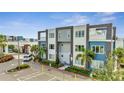 Modern building exterior with balconies and parking at 7770 Sandy Ridge Dr # 201, Reunion, FL 34747