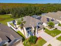 Two-story house with a pool and solar panels, seen from above at 1740 N Hampton Dr, Davenport, FL 33897