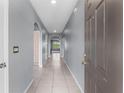 Bright and airy entryway with tile flooring and neutral walls at 816 William Way, Haines City, FL 33844