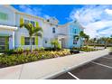 Townhouses with parking and tropical landscaping at 2980 On The Rocks Pt, Kissimmee, FL 34747