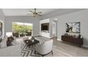 Spacious living area with large sliding glass doors and wood-look floors at 621 Knightsbridge Cir, Davenport, FL 33896