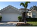 One story house with two car garage and landscaping at 608 Copeland Dr, Haines City, FL 33844