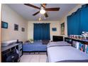 bedroom with twin beds and built-in shelving at 725 Michigan Ct # 3, St Cloud, FL 34769