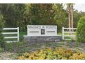 Magnolia Pointe community entrance sign with landscaping at 183 Bull Frog Ln, Umatilla, FL 32784