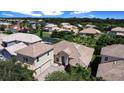 Aerial view of a house in a residential neighborhood at 3757 Eagle Isle Cir, Kissimmee, FL 34746