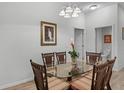 Bright dining room with a glass-top table and wicker chairs at 306 Lucaya Loop # B5/U306, Davenport, FL 33897