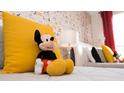 bedroom with Mickey Mouse decor and twin beds at 1676 Moon Valley Dr, Davenport, FL 33896
