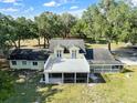 Aerial view of a two story house with large deck and yard at 4350 E Hinson Ave, Haines City, FL 33844