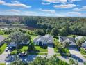 Aerial view of a house near a lake at 5232 Deer Creek Dr, Orlando, FL 32821