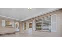 Front porch with tiled flooring and access to front door at 912 Avenue T Se, Winter Haven, FL 33880
