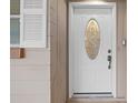 White front door with a decorative glass window at 912 Avenue T Se, Winter Haven, FL 33880