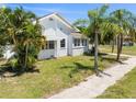 White brick home with a sidewalk at 751 Avenue B Sw, Winter Haven, FL 33880