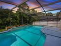 Inviting screened pool area, perfect for relaxation and entertainment at 1049 Lake Berkley Dr, Kissimmee, FL 34746
