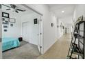 Bright hallway with tile flooring, leading to bedrooms and other areas of the home at 1294 Harbor Ridge Dr, Kissimmee, FL 34759