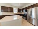 Modern kitchen with stainless steel appliances at 794 Citrus Isle Dr, Davenport, FL 33837