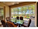 Enjoy a relaxing view from this screened patio, featuring a table and chairs at 341 Navarra Ln, Davenport, FL 33837